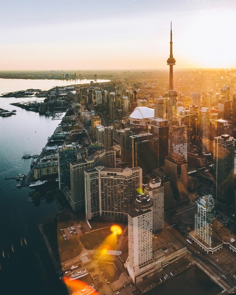 Aerial view of Toronto waterfront and CN Tower at sunset